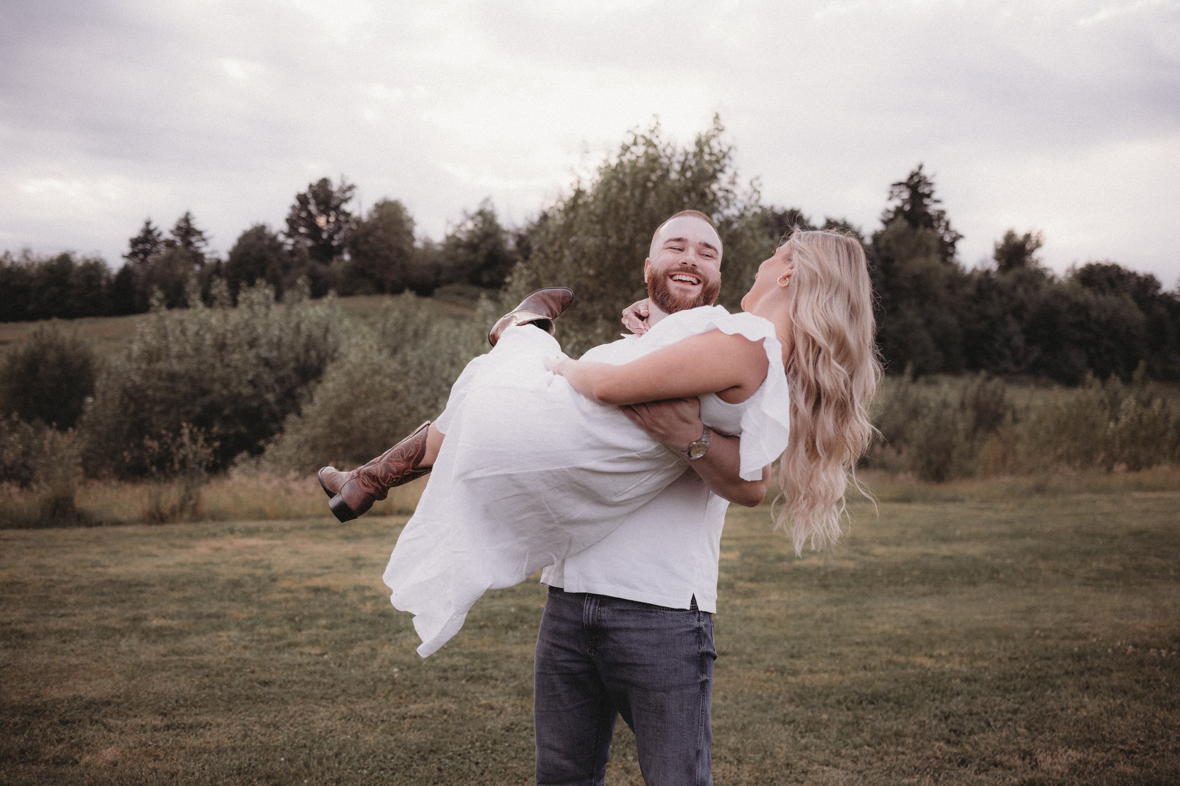 Matthew lifting Robyn outdoors